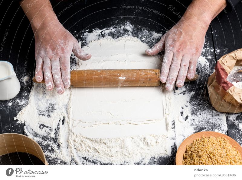 process of making dough by male hands Dough Baked goods Bread Table Kitchen Human being Hand 30 - 45 years Adults Sieve Make Black White rolling Pizza Flour pin