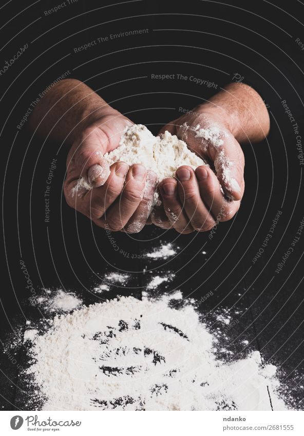 white wheat flour in male hands, black background Dough Baked goods Bread Table Kitchen Human being Hand Wood Make Dark Black White Flour Pizza Bakery Home-made