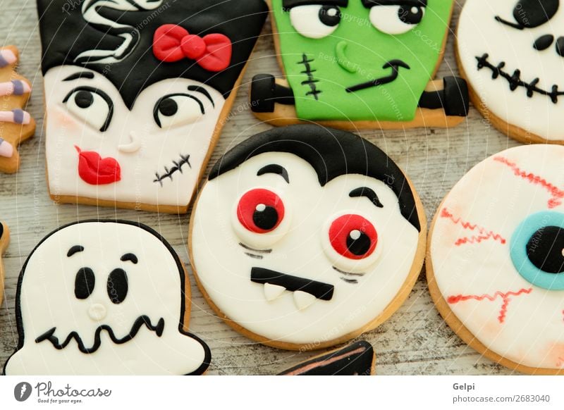 Halloween cookies with different shapes Dessert Joy Face Decoration Table Feasts & Celebrations Hallowe'en Autumn Wood Smiling Creepy Delicious Brown Black