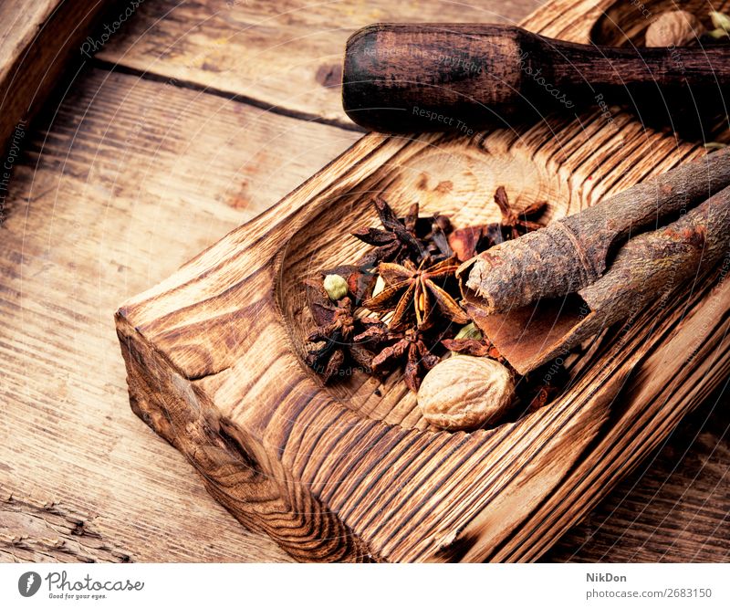 Spicy aniseed and cinnamon Mortar seasoning Cinnamon Food Brown Stars Component Stick Aromatic Close-up Rustic Clove Scent Fragrant Heap Odor oriental Vintage