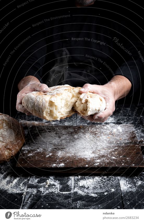 baked bread Bread Nutrition Table Kitchen Cook Human being Hand 30 - 45 years Adults Wood Make Dark Fresh Hot Brown Black White Tradition Baking Baker Bakery