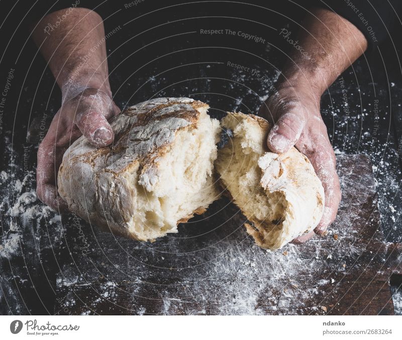 broken white bread in male hands Bread Nutrition Table Kitchen Cook Human being Hand Fingers Wood Make Dark Fresh Brown Black White Tradition Baking Baker