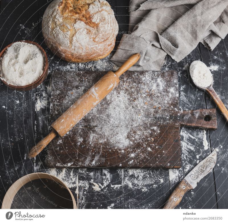 baked bread, white wheat flour, wooden rolling pin Bread Bowl Spoon Table Kitchen Sieve Wood Eating Make Dark Fresh Above Brown White Flour Top Bakery