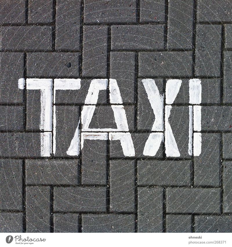 ...to Paris Means of transport Passenger traffic Motoring Street Taxi Stone Sign Characters Signs and labeling Driving Colour photo Subdued colour Exterior shot