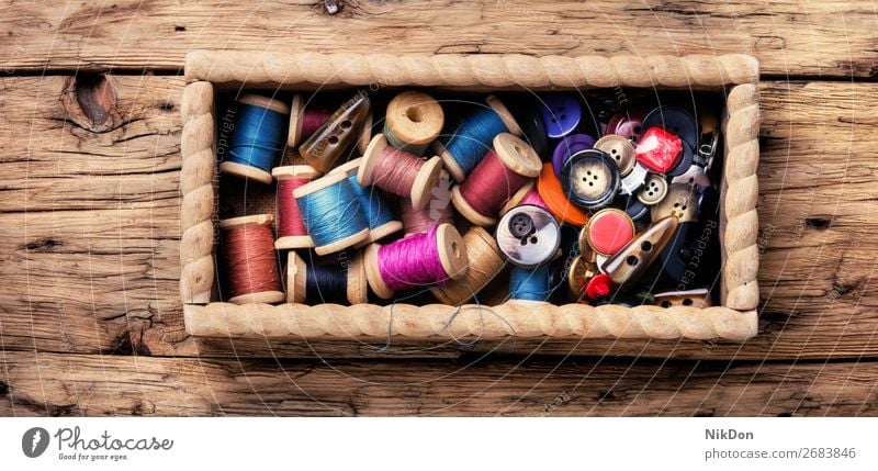 Thread spools and buttons thread sewing textile cloth craft fashion tailor needlework colorful clothing closeup fabric hobby tool old bobbin handmade accessory