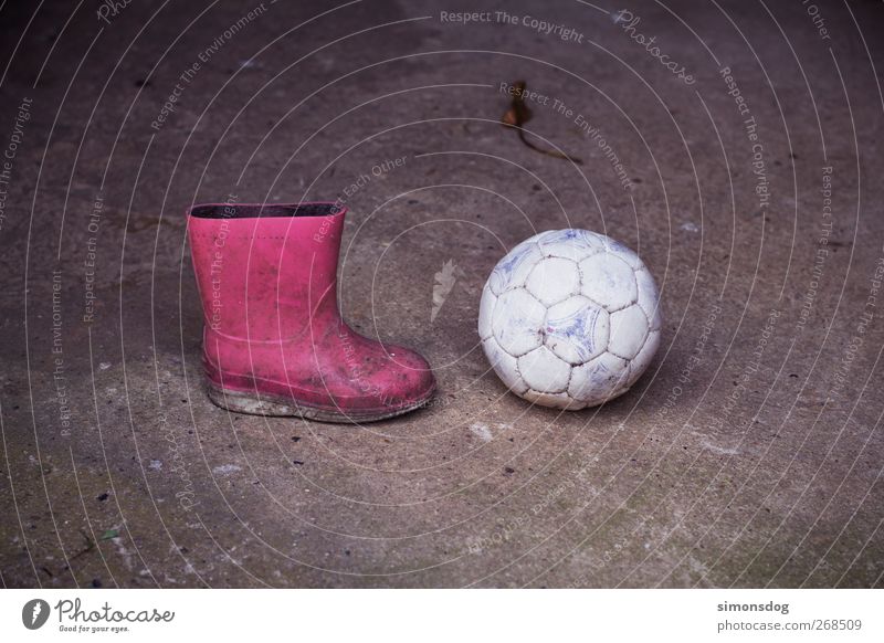 boycott? Ball Boots Rubber boots Dirty Round Pink Infancy Asphalt Kick off Stagnating Colour photo Exterior shot Deserted Copy Space top Copy Space bottom