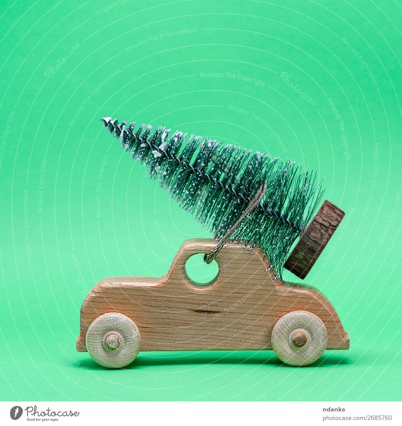 wooden toy car carrying a festive tree on the roof Decoration Feasts & Celebrations Christmas & Advent New Year's Eve Tree Transport Car Toys Wood Small Retro