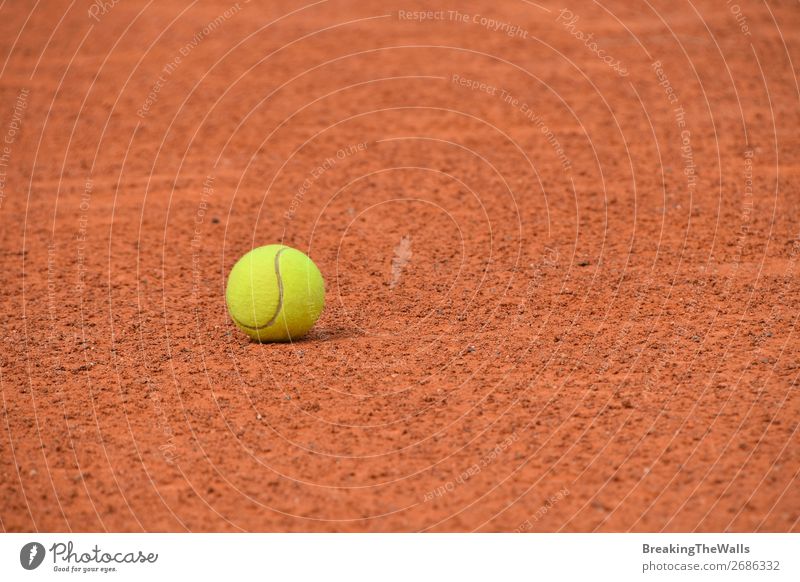 Yellow tennis ball on red clay ground court Sports Ball sports Stadium Dirty Brown Red Competition Tennis Court building Clay Ground Vantage point Arena field
