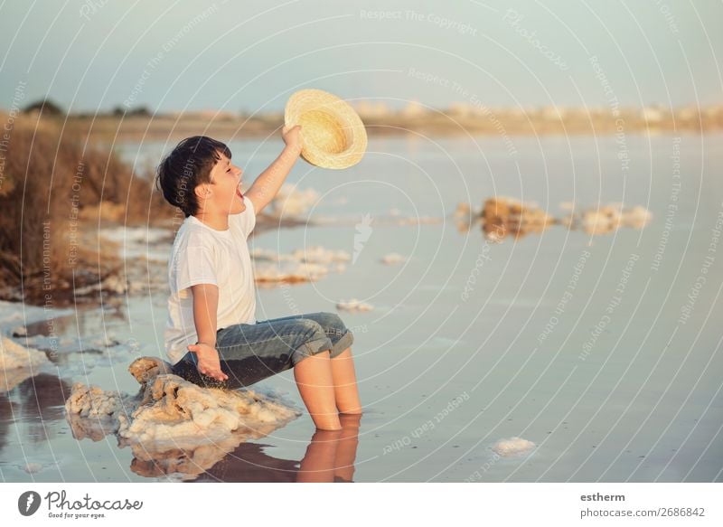 happy child with hat in the beach with arms open Lifestyle Joy Happy Wellness Relaxation Vacation & Travel Adventure Freedom Summer Summer vacation Beach Ocean