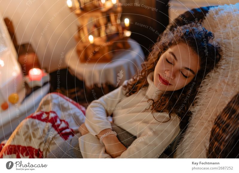 sleeping woman on comfy chair at christmas Woman attractive beautiful caucasian christmas pyramide comfort comfortable couch cozy enjoying feel female girl home