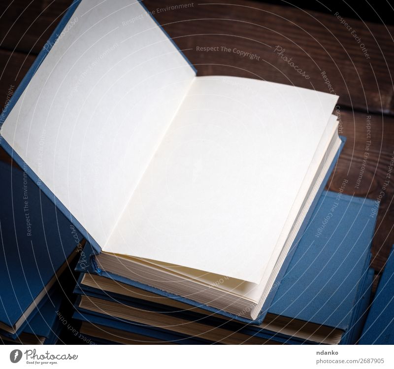 Stack Of Various Books Open Book On Top A Royalty Free Stock