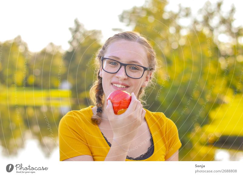 Young woman with an apple in her hand Food Apple Picnic Lifestyle Healthy Healthy Eating Summer Feminine Youth (Young adults) 1 Human being 13 - 18 years
