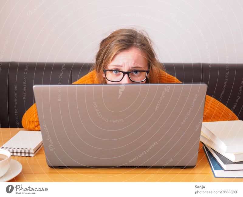 Young desperate student with glasses looks over a laptop Lifestyle Study University & College student Notebook Information Technology Feminine Young woman