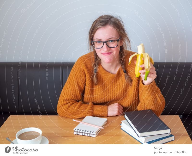 Student studying with books and a cup of coffee Food Banana Eating Beverage Hot drink Joy Healthy Eating Contentment Flat (apartment) Desk Education Study
