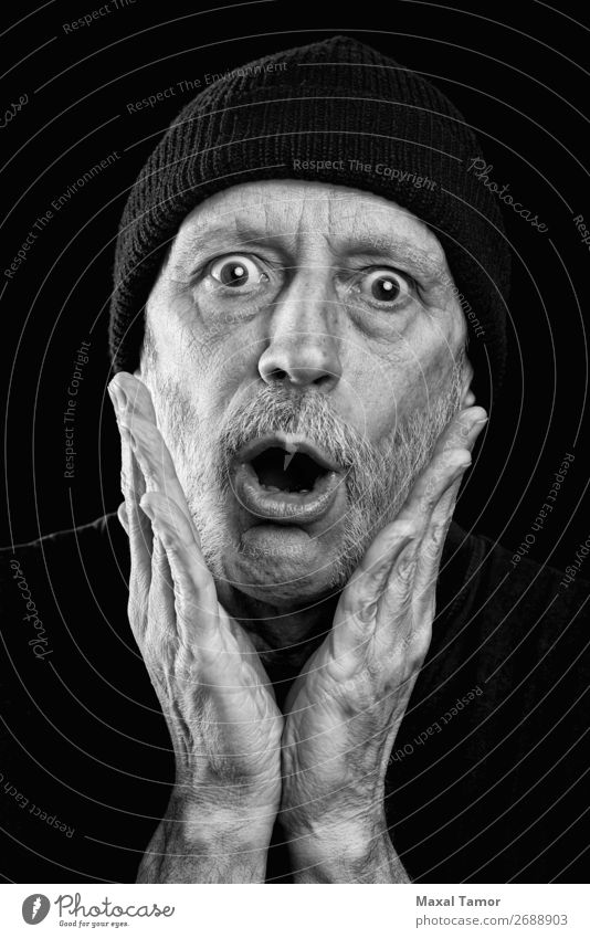 Surprised strong man with a beard and a woolen cap Face To talk Loudspeaker Human being Man Adults Mouth Hand Beard Scream Sadness Crazy Anger Black White
