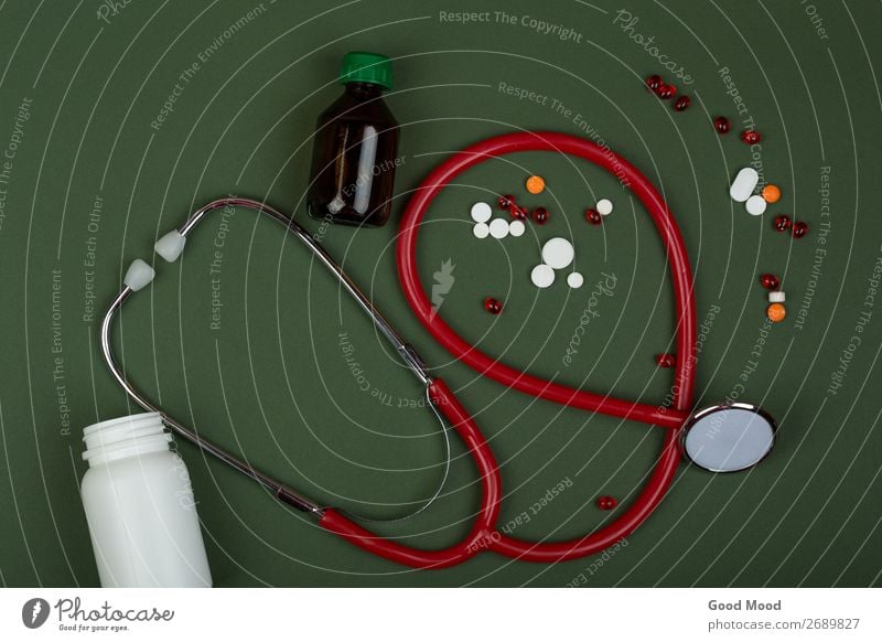 red stethoscope, colorful pills and medical bottles Bottle Health care Medical treatment Illness Medication Science & Research Doctor Hospital Container Green