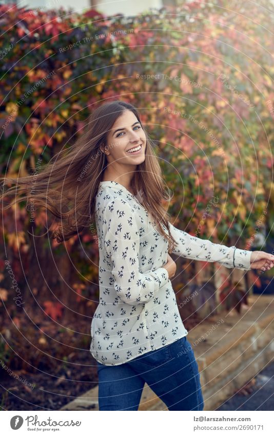 Carefree happy young woman tossing her hair Happy Face Woman Adults 1 Human being 18 - 30 years Youth (Young adults) Autumn Leaf Street Smiling Thin Happiness