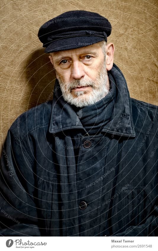 Portrait of a Man with Beard and a Cap Face Ocean Homosexual Adults Jacket Coat Leather Scarf Old Cool (slang) Strong Black White attractive bad bad boy bandit