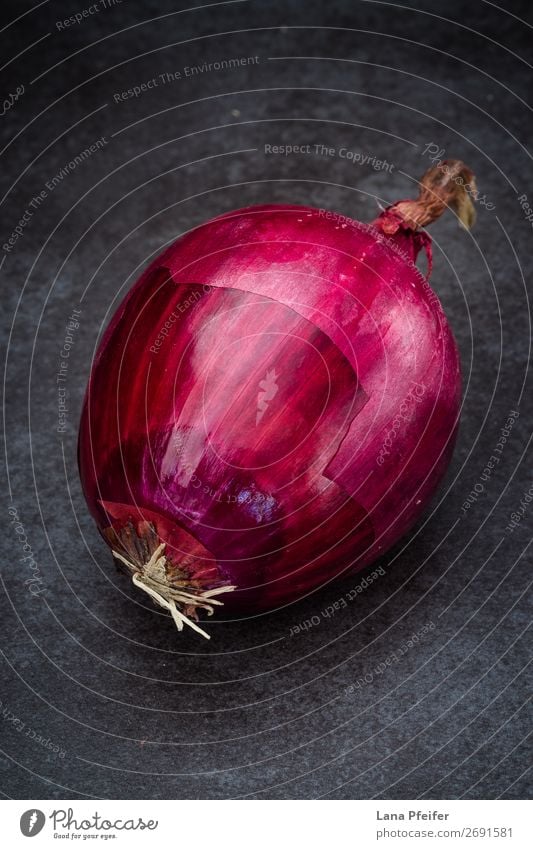 Red onion in close up Food Vegetable Fruit Nutrition Eating Kitchen Dark Fresh Bright Natural Colour background Ingredients one Onion recipe Surface Unpeeled