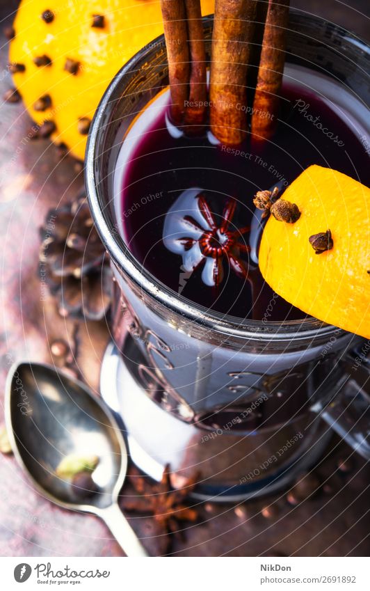 Mulled wine with orange wineglass cinnamon drink holiday christmas hot beverage xmas anise warm mulled spice winter punch alcohol spices grog fruit celebration