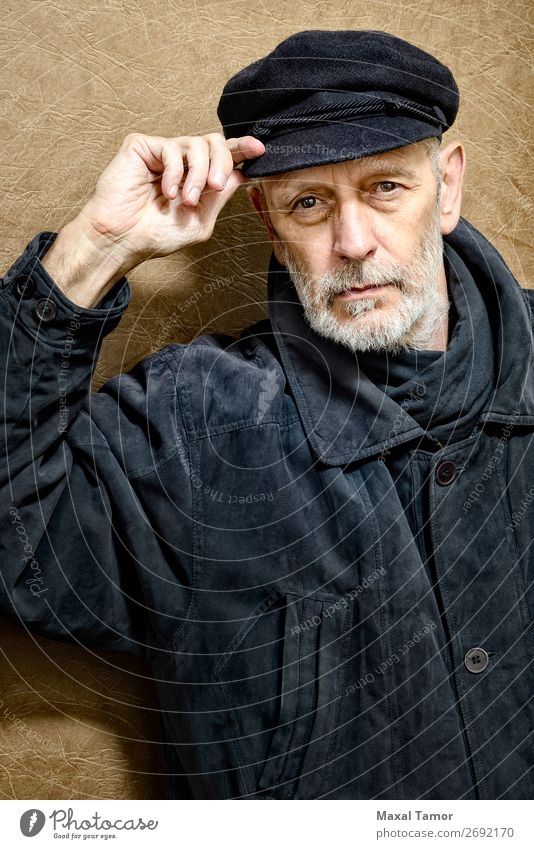 Portrait of a Man with Beard and a Cap Face Ocean Homosexual Adults Jacket Coat Leather Scarf Old Cool (slang) Strong Black White attractive bad bad boy bandit