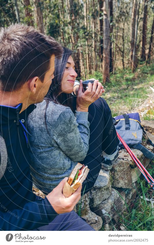 Couple pausing while doing trekking Eating Drinking Lifestyle Leisure and hobbies Vacation & Travel Adventure Mountain Hiking Sports Climbing Mountaineering