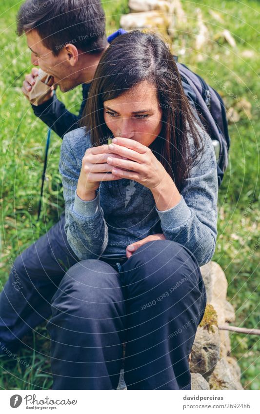 Couple pausing while doing trekking Eating Drinking Coffee Lifestyle Leisure and hobbies Vacation & Travel Adventure Mountain Hiking Sports Climbing