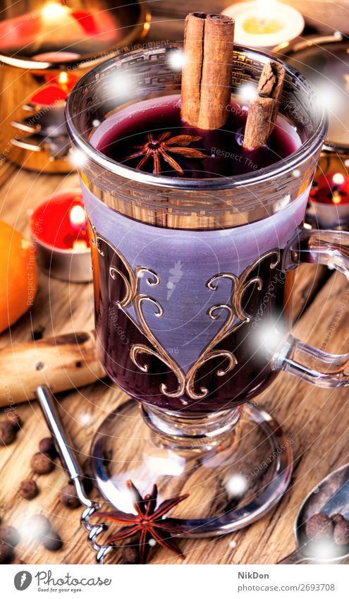 mulled wine in stylish glass wineglass cinnamon drink holiday christmas hot beverage xmas anise warm spice winter orange punch alcohol cup food grog fruit