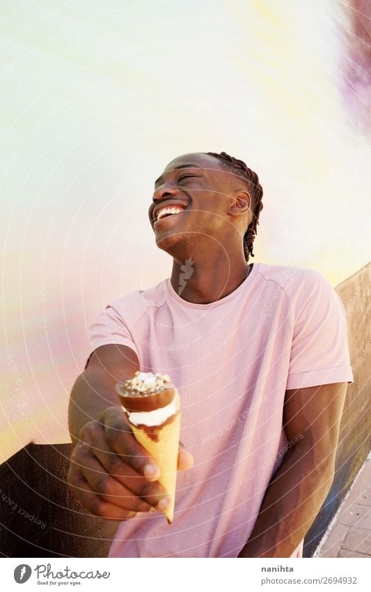 Young handsome black man holds a ice cream cone Food Ice cream Style Happy Summer Sunbathing Human being Masculine Young man Youth (Young adults) Man Adults 1