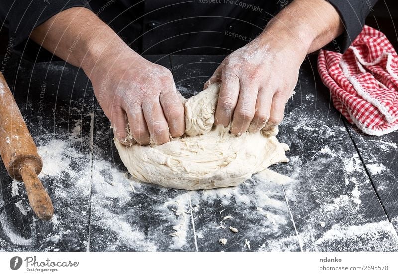 cook kneads white wheat flour dough Dough Baked goods Bread Nutrition Table Kitchen Man Adults Hand Wood Make Black White Tradition Baking Baker Bakery board