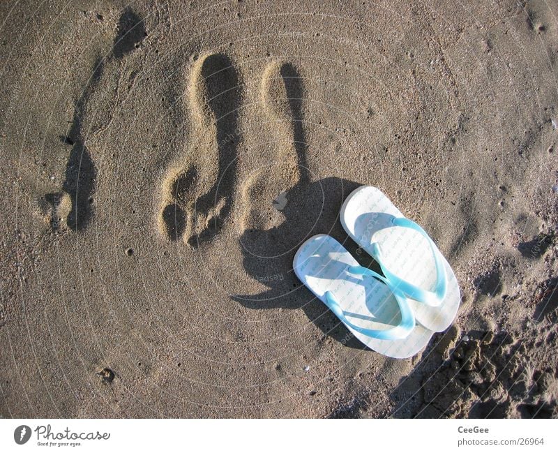 gone Flip-flops Beach shoes Footwear Ocean Footprint Wet Damp Leisure and hobbies Sand Water Feet Shadow Barefoot