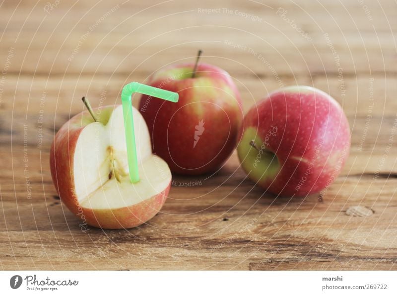 apple juice production Food Fruit Nutrition Beverage Drinking Cold drink Lemonade Juice Red Apple Juicy Fruity Blade of grass Wooden table Colour photo