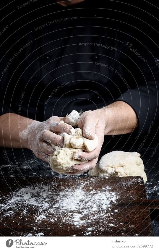 baker kneads white wheat flour dough Dough Baked goods Bread Nutrition Table Kitchen Work and employment Cook Human being Man Adults Hand Fingers Wood Make