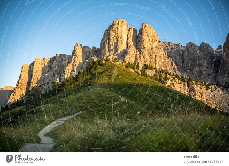 Gardena Pass with view to the Bruneck Tower Grödener Joch Mountain Dolomites South Tyrol mountain road road trip Sunset Idyll Summer vacation Hiking