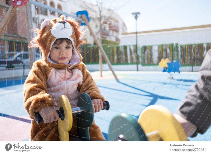 Little kid with bear or lion costume Joy Happy Playing Winter Hallowe'en Kindergarten Child Human being Baby Boy (child) Man Adults Park Playground Smiling