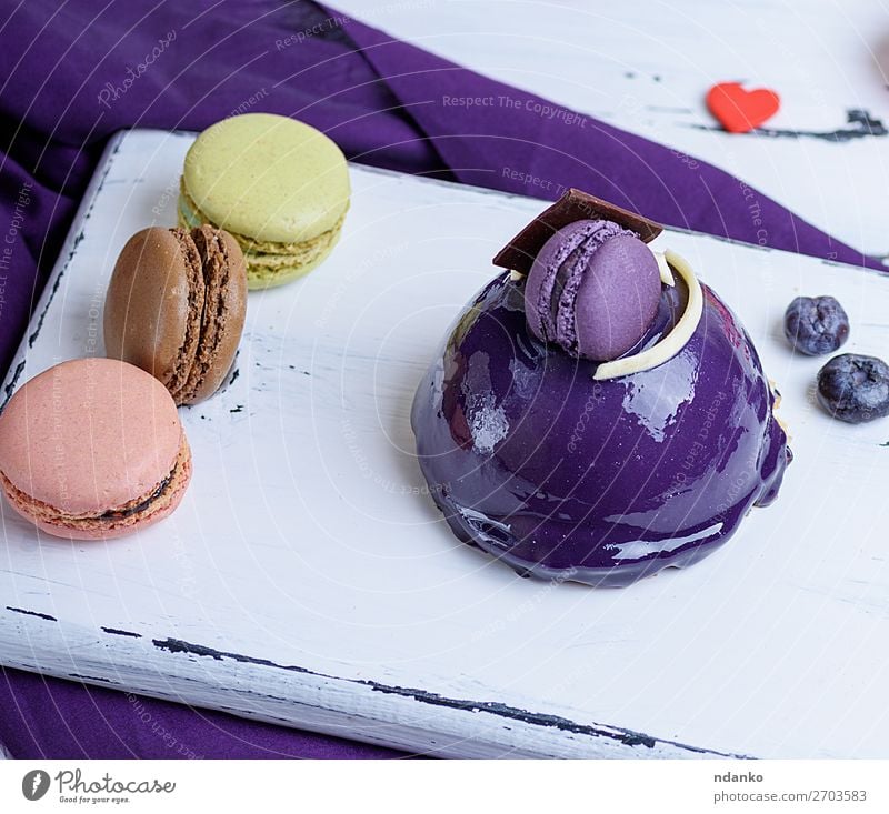 lilac round cake with macarons Dessert Candy Decoration Table Feasts & Celebrations Wood Small Delicious Blue Yellow White Colour background Bakery Berries