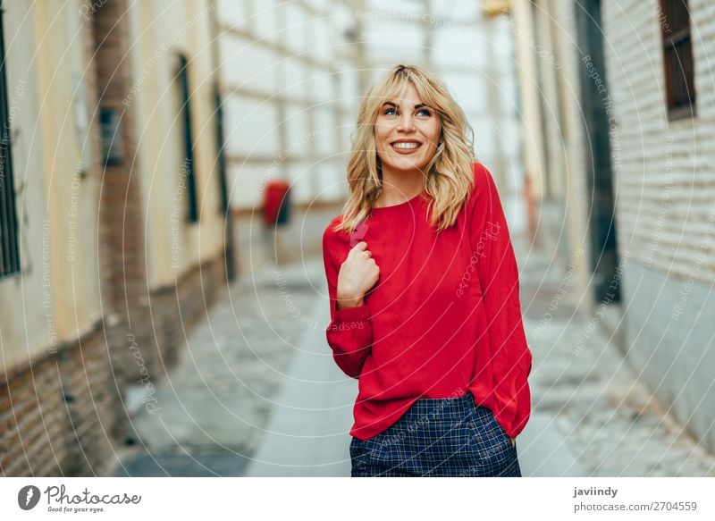 Happy young blond woman walking down the street. Lifestyle Style Beautiful Hair and hairstyles Human being Feminine Young woman Youth (Young adults) Woman