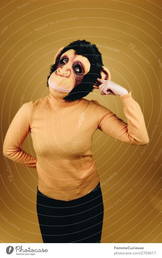 Woman with monkey mask drilling in her ear Feminine Adults 1 Human being 18 - 30 years Youth (Young adults) 30 - 45 years Joy Funny Ear Drill Touch Mask