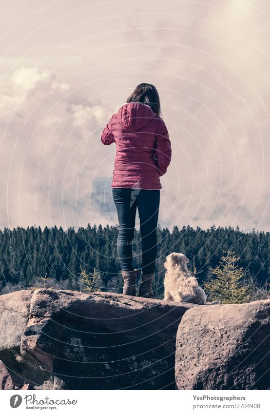 Millennial girl and her dog on mountain rocks Joy Relaxation Vacation & Travel Trip Adventure Mountain Hiking Human being Feminine Young woman