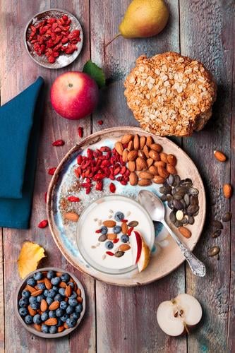 Breakfast on table. Yogurt with added blueberries and almonds Food Yoghurt Dairy Products Fruit Apple Grain Bread Dessert Nutrition Eating Lunch Organic produce