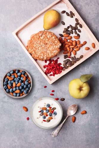 Breakfast on table. Yogurt with added blueberries and almonds Food Yoghurt Dairy Products Fruit Apple Bread Dessert Nutrition Eating Lunch Organic produce