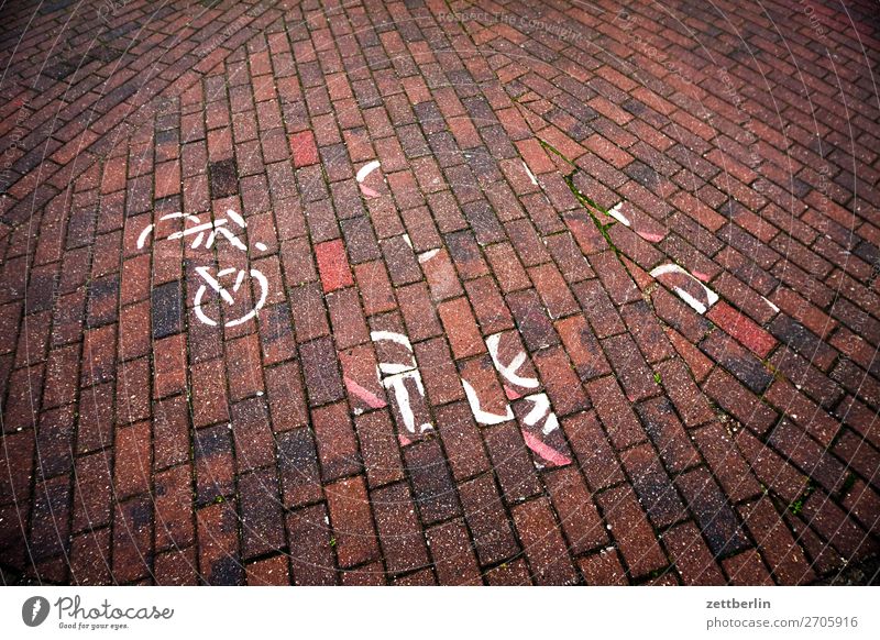 trumpet of words Bicycle Cycling Cycling tour Cycle path Traffic lane Lettering Signs and labeling Lane markings Pavement Paving stone Broken Destruction