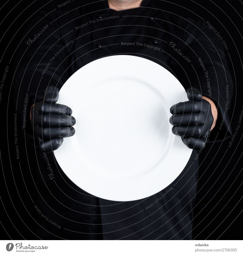 Chef in black uniform holding a round empty plate Plate Kitchen Restaurant Profession Cook Human being Man Adults Hand Gloves Dark Black White chef Hold Uniform