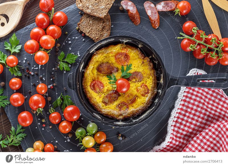 omelette from chicken eggs with red cherry tomatoes Food Sausage Vegetable Herbs and spices Nutrition Breakfast Lunch Dinner Pan Table Wood Fresh Above Yellow