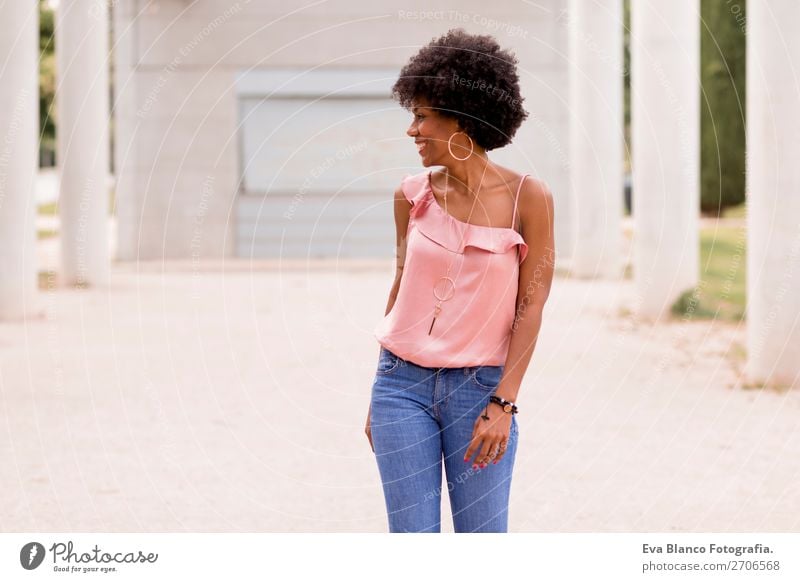 beautiful afroamerican woman talking on mobile phone Lifestyle Happy Beautiful Hair and hairstyles Summer Woman Adults Landscape Park Fashion Jeans Afro Smiling