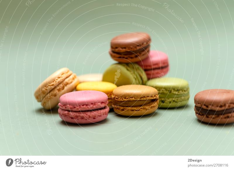 Above view of colorful macaroons on a marble background Dessert Gastronomy Fresh Bright Delicious Soft Yellow Green Colour Beaded Orange Purple appetizing