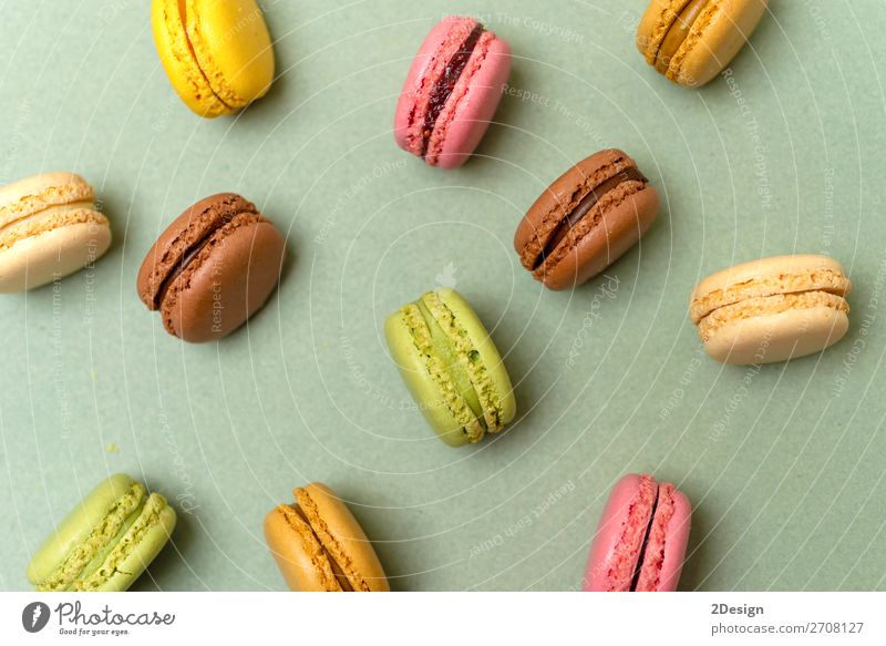 Above view of colorful macaroons on a marble background Dessert Gastronomy Fresh Bright Delicious Soft Yellow Green Colour Beaded Orange Purple appetizing