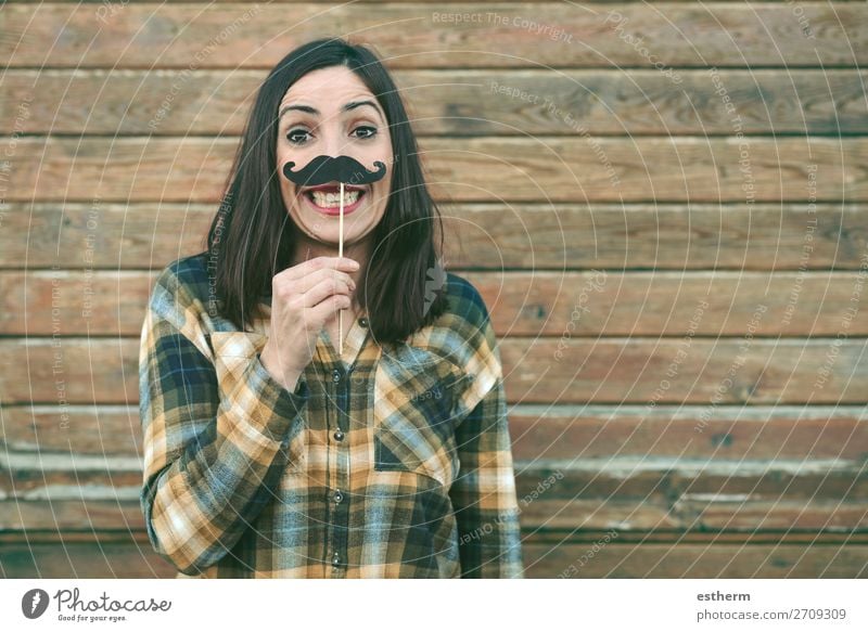 Funny young woman holding mustache on stick outdoors Lifestyle Joy Happy Entertainment Event Feasts & Celebrations Carnival Fairs & Carnivals Human being