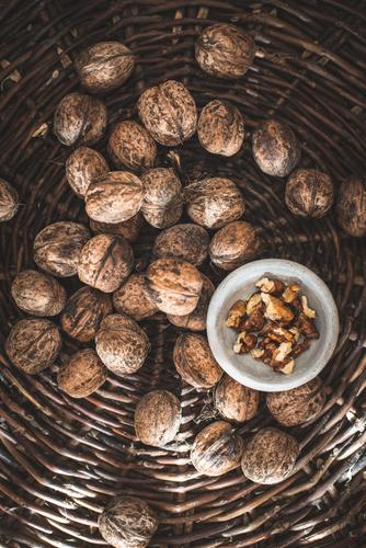 Walnuts in a vintage basket. Bowl Nature Autumn Old Authentic Natural Brown walnuts Mussel shell To break (something) food cracking Organic Nutshell cracker