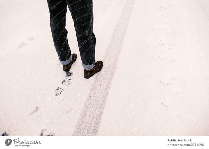 Person standing on snowy road Street Snow Winter Asphalt trace Legs Stand Human being Nature Cold Landscape White Seasons Frost Day Frozen Trip Transport